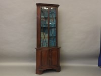 Lot 676 - An Edwardian freestanding glazed corner cupboard