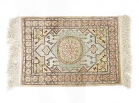 Lot 468 - A Nepalese silk cream ground prayer rug