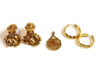 Lot 36 - A pair of Indian high carat gold earrings