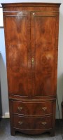 Lot 580 - An early 20th century mahogany bow fronted gentleman's robe