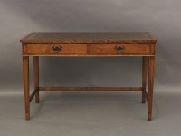 Lot 700 - An oak writing table