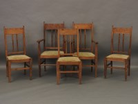 Lot 739 - A set of five Arts and Crafts oak and dog tooth inlaid chairs