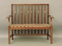 Lot 771 - An Art Nouveau stained beech settee
