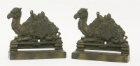 Lot 157 - Two fireside camel strikers