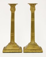 Lot 46 - A near pair of gilt metal candlesticks