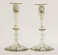Lot 135 - A pair of Battersea enamel candlesticks