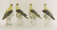 Lot 24 - Four porcelain models of golden orioles