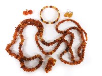 Lot 1149 - A gold Russian amber vine leaf and grape brooch