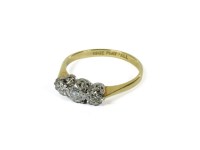 Lot 1173 - A three stone illusion set diamond ring
