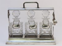 Lot 1284 - Silver plated Tantalus and wine labels
