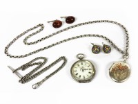 Lot 1156 - A silver oval locket with applied gold Swallow motif