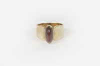 Lot 23 - A 9ct gold single stone garnet cabochon ring
