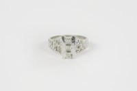 Lot 28 - A white gold three stone diamond ring