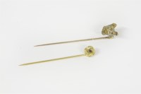 Lot 11 - A gold dog's head stick pin
