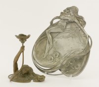Lot 132 - A patinated bronze candlestick