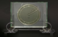 Lot 234 - An Art Deco green glass and chrome mantel clock