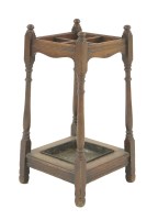 Lot 82 - A walnut stick stand
