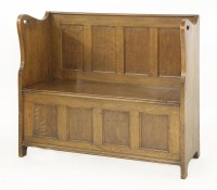 Lot 134 - An Arts & Crafts oak hall bench