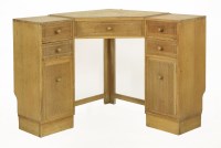 Lot 278 - An Heal & Son oak corner desk