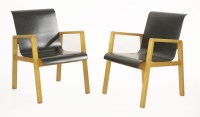 Lot 302 - A pair of model 403 laminate birch armchairs