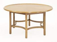 Lot 633 - A teak and maple coffee table
