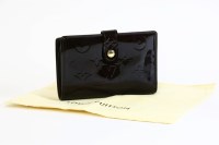 Lot 1186 - A Louis Vuitton vernis 'Viennois' amarante wallet