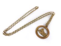 Lot 1122 - A 9ct gold Aquarius zodiac pendant