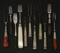 Lot 32 - Four assorted forks with silver tines