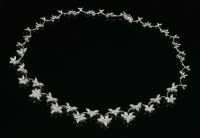 Lot 304 - A white gold diamond set festoon necklace