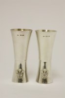 Lot 558 - A pair of Elizabeth II commemorative double-ended spirit measures