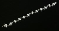 Lot 310 - A white gold two-row diamond set line bracelet