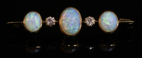 Lot 72 - An Edwardian five stone opal and diamond bar brooch