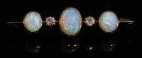 Lot 72 - An Edwardian five stone opal and diamond bar brooch