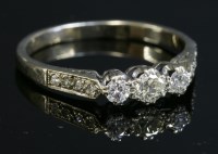 Lot 323 - A three stone diamond ring