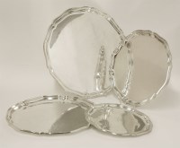 Lot 395 - A graduated set of three German silver trays