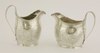 Lot 476 - Two George III silver creamers