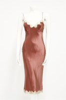 Lot 1287 - A Dolce and Gabbana black silk and lace evening dress