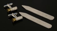 Lot 1581 - A pair of sterling silver shot gun cartridge swivel cufflinks by Holland and Holland