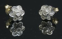 Lot 330 - A pair of 9ct gold diamond set cluster earrings