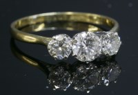Lot 287 - An 18ct gold three stone diamond ring