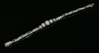 Lot 138 - An Art Deco platinum and white gold graduated diamond set bracelet