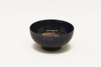 Lot 162 - A small William Moorcroft 'Pansy' pattern bowl