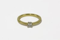 Lot 15 - An 18ct gold single stone emerald cut diamond ring