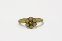 Lot 18 - A gold demantoid garnet and coral cabochon daisy cluster ring
4.51g