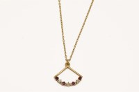 Lot 63 - A 9ct gold diamond and ruby fan pendant