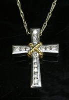 Lot 363 - An 18ct yellow and white gold diamond set cross