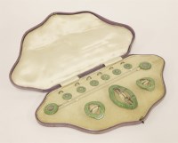 Lot 561 - A George V cased silver and green enamel stud