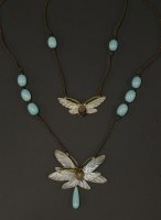 Lot 117 - An Art Nouveau two-row carved horn pendant