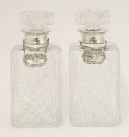 Lot 565 - A pair of Elizabeth II cut-glass and silver-mounted decanters