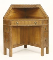 Lot 76 - An Arts and Crafts oak corner desk